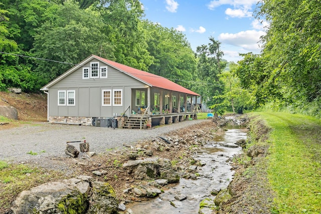 333 Cubbins Hollow Rd, Dowelltown, TN 37059 - rear view of property featuring a wooded view and board and batten siding