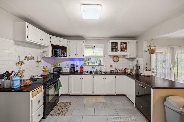 333 Cubbins Hollow Rd, Dowelltown, TN 37059 - kitchen with black appliances, tasteful backsplash, dark countertops, a peninsula, and white cabinets