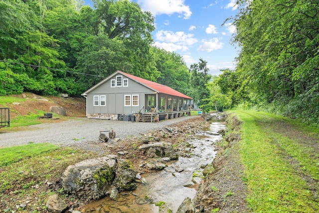 333 Cubbins Hollow Rd, Dowelltown, TN 37059 - view of property exterior with a forest view and board and batten siding