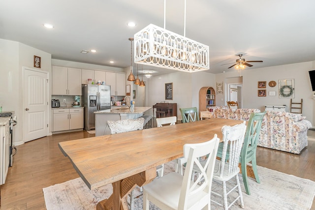 6531 Tulip Tree Dr, Murfreesboro, TN 37128 - dining room with ceiling fan, light wood-type flooring, arched walkways, and recessed lighting