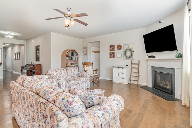 6531 Tulip Tree Dr, Murfreesboro, TN 37128 - living area with hardwood / wood-style flooring, ceiling fan, a fireplace with flush hearth, and baseboards