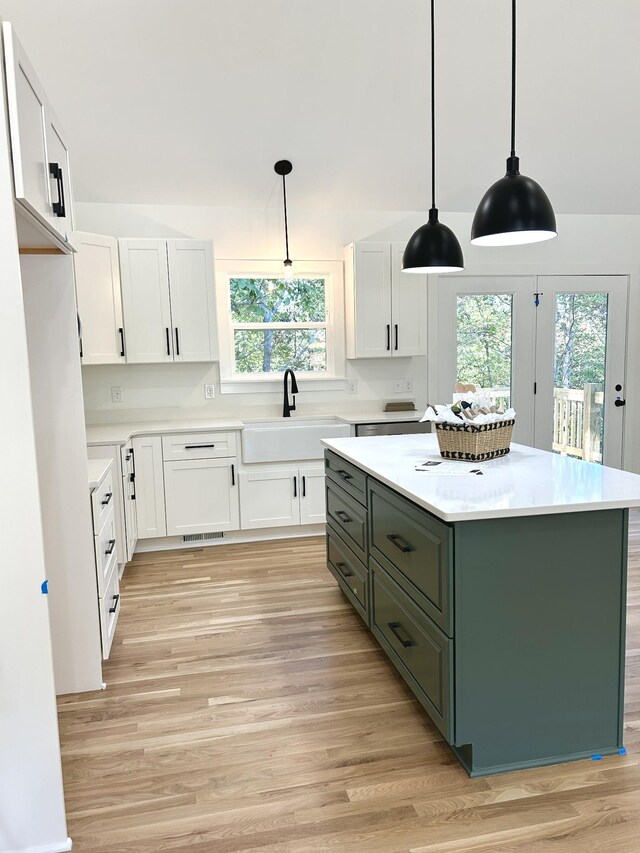 5708 Little Dry Creek Rd, Pulaski, TN 38478 - kitchen featuring a sink, white cabinets, healthy amount of natural light, and light wood finished floors