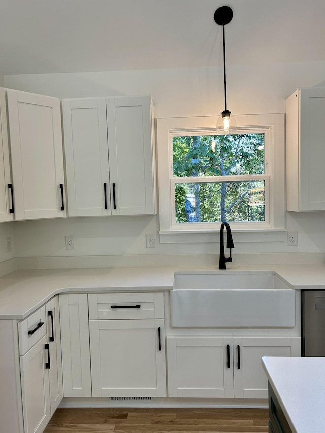 5702 Little Dry Creek Rd, Pulaski, TN 38478 - kitchen with a sink, white cabinetry, light countertops, and dishwasher