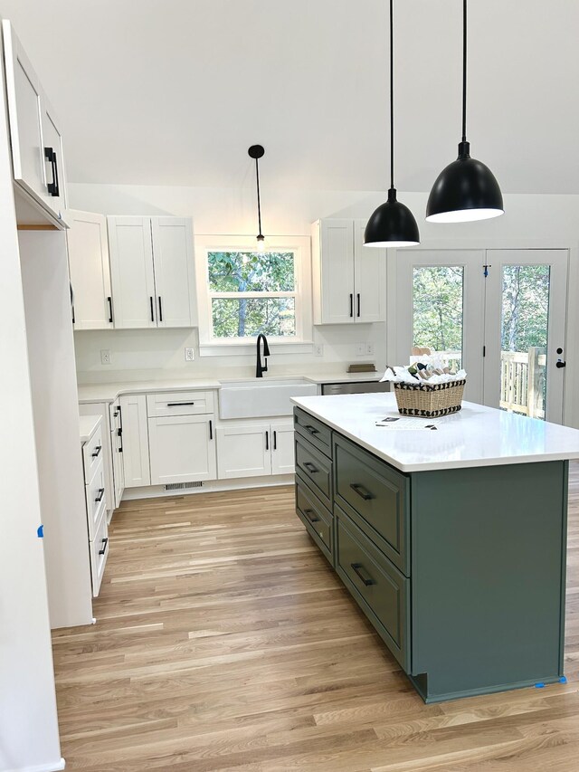 5702 Little Dry Creek Rd, Pulaski, TN 38478 - kitchen featuring a sink, white cabinetry, light wood finished floors, and plenty of natural light