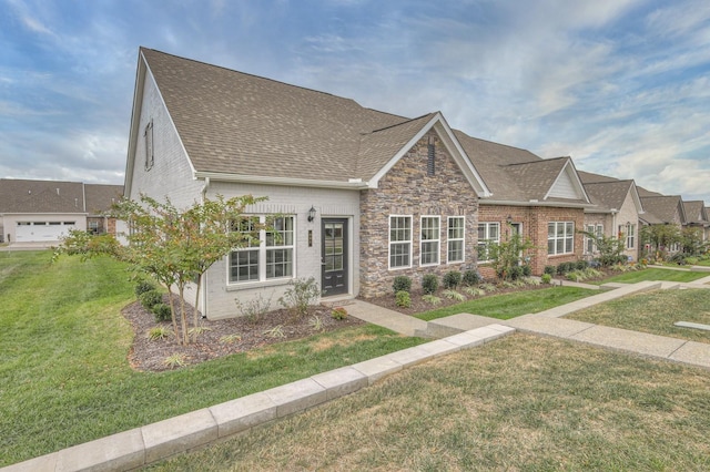 881 Meadowcrest Way, Lebanon, TN 37090 - view of front of house with a front lawn, a shingled roof, brick siding, and stone siding