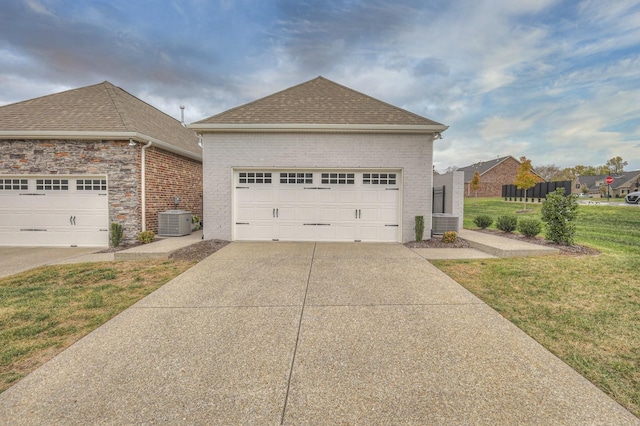 881 Meadowcrest Way, Lebanon, TN 37090 - view of property exterior with a shingled roof, a yard, a garage, and brick siding