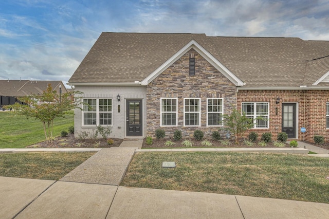 881 Meadowcrest Way, Lebanon, TN 37090 - view of front of home featuring a front yard, roof with shingles, brick siding, and stone siding
