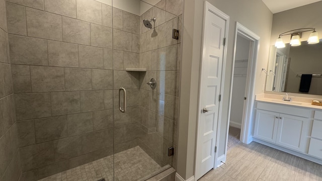 881 Meadowcrest Way, Lebanon, TN 37090 - bathroom featuring a shower stall, vanity, tile patterned floors, and a spacious closet