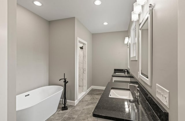 2420 Eagle Rock Rd, Monteagle, TN 37356 - full bath with a freestanding tub, double vanity, recessed lighting, a stall shower, and baseboards