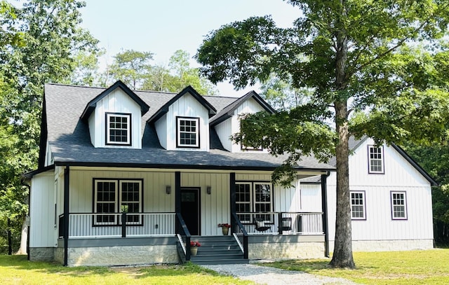 2420 Eagle Rock Rd, Monteagle, TN 37356 - modern farmhouse style home with a porch, a shingled roof, and a front yard