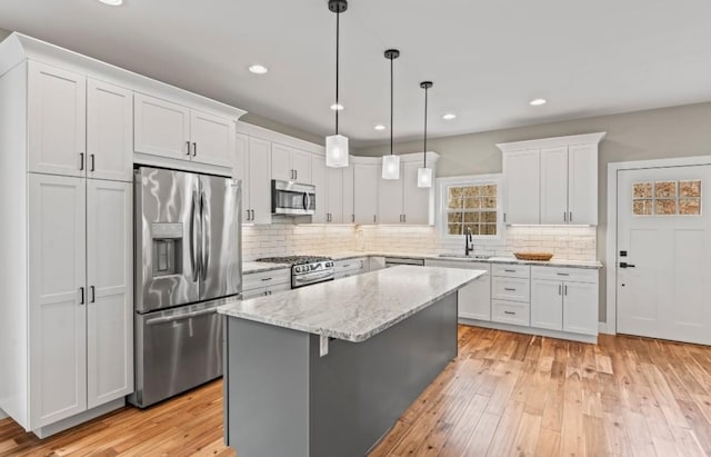 2420 Eagle Rock Rd, Monteagle, TN 37356 - kitchen featuring stainless steel appliances, a sink, a center island, white cabinets, and recessed lighting