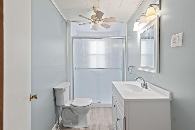 208 S Russell St, Portland, TN 37148 - full bath featuring wood finished floors, vanity, toilet, a stall shower, and ceiling fan