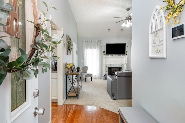 5026 Claude Dr, Smyrna, TN 37167 - entryway featuring lofted ceiling, a high end fireplace, ceiling fan, and light wood finished floors