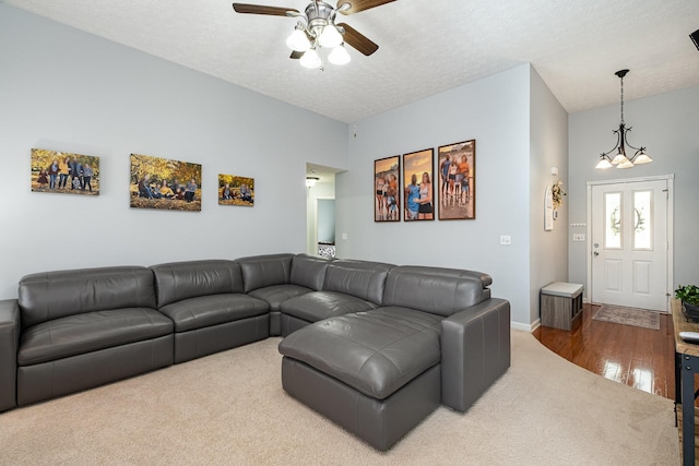 5026 Claude Dr, Smyrna, TN 37167 - living room with carpet flooring, ceiling fan, a chandelier, wood finished floors, and a textured ceiling
