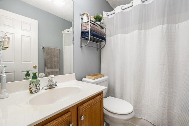 5026 Claude Dr, Smyrna, TN 37167 - bathroom with toilet, vanity, and curtained shower