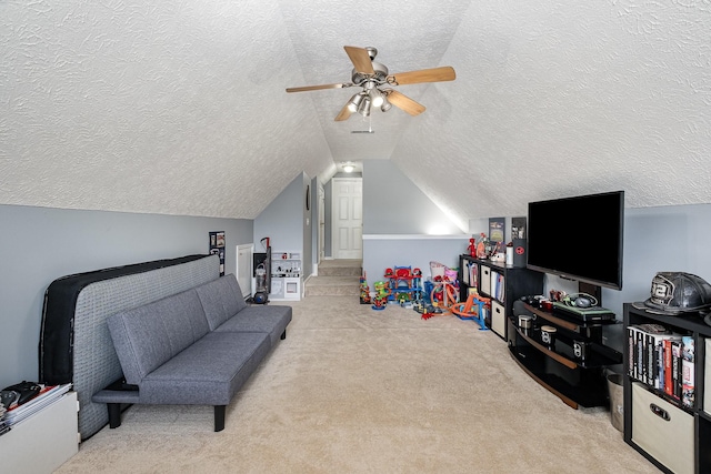 5026 Claude Dr, Smyrna, TN 37167 - playroom featuring a textured ceiling, carpet floors, vaulted ceiling, and ceiling fan
