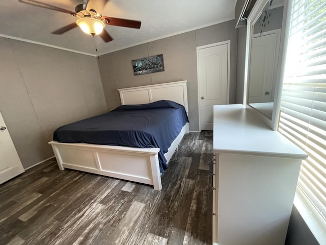 454 Slater Loop, Pikeville, TN 37367 - bedroom featuring dark wood-type flooring, crown molding, a ceiling fan, and a decorative wall
