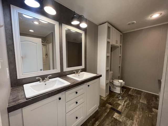 454 Slater Loop, Pikeville, TN 37367 - bathroom with toilet, wood finished floors, double vanity, and a shower