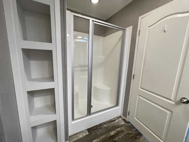 454 Slater Loop, Pikeville, TN 37367 - bathroom featuring a stall shower and wood finished floors