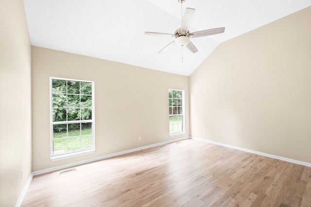 2210 Falcon Creek Dr, Franklin, TN 37067 - spare room featuring light wood-style flooring, lofted ceiling, a ceiling fan, and baseboards