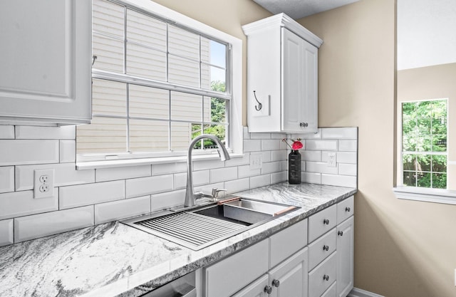 2210 Falcon Creek Dr, Franklin, TN 37067 - kitchen with a sink, tasteful backsplash, white cabinets, and healthy amount of natural light