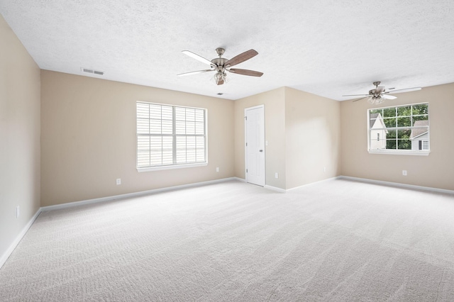 2210 Falcon Creek Dr, Franklin, TN 37067 - spare room with ceiling fan, light colored carpet, baseboards, and a textured ceiling