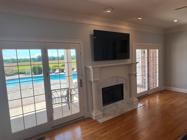 6464 Lebanon Rd, Murfreesboro, TN 37129 - unfurnished living room with plenty of natural light, wood finished floors, a premium fireplace, crown molding, and recessed lighting