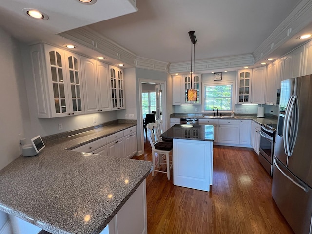 6464 Lebanon Rd, Murfreesboro, TN 37129 - kitchen featuring appliances with stainless steel finishes, a peninsula, a sink, white cabinetry, and dark wood-type flooring