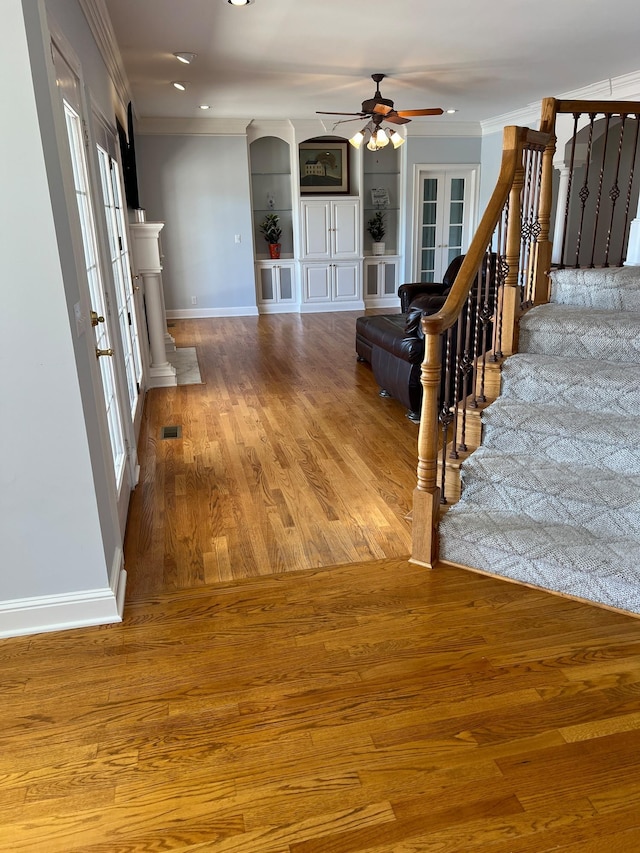 6464 Lebanon Rd, Murfreesboro, TN 37129 - entrance foyer featuring ceiling fan, baseboards, ornamental molding, wood finished floors, and stairway