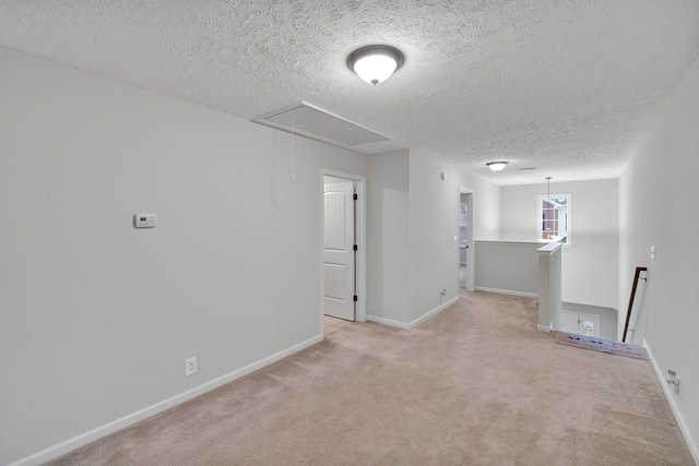 4822 Octavia St, Murfreesboro, TN 37129 - unfurnished room featuring attic access, a textured ceiling, light carpet, and baseboards