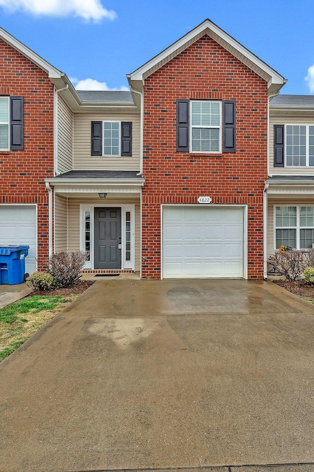 4822 Octavia St, Murfreesboro, TN 37129 - traditional-style house with concrete driveway, an attached garage, and brick siding