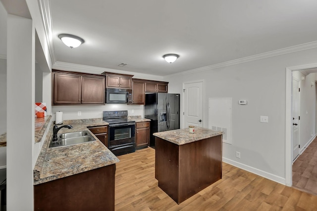 4822 Octavia St, Murfreesboro, TN 37129 - kitchen with black appliances, a sink, a kitchen island, light wood-type flooring, and ornamental molding