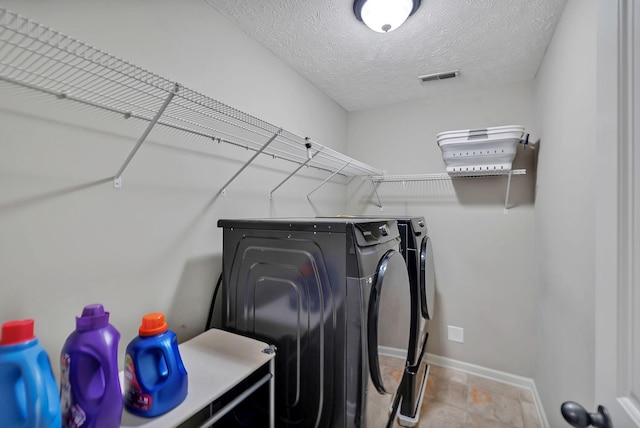 4822 Octavia St, Murfreesboro, TN 37129 - washroom with separate washer and dryer, baseboards, and a textured ceiling