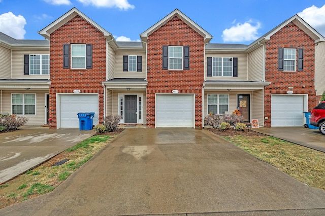 4822 Octavia St, Murfreesboro, TN 37129 - townhome / multi-family property with driveway, brick siding, and an attached garage