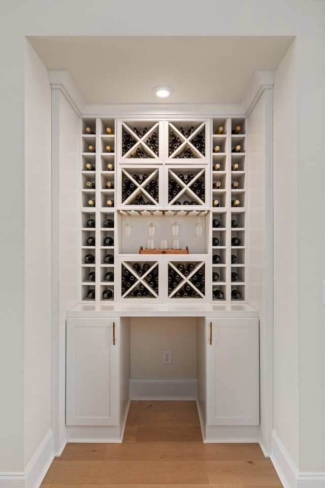 7271 Murrel Dr, Franklin, TN 37064 - wine room with light wood finished floors, recessed lighting, and baseboards