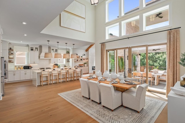 7271 Murrel Dr, Franklin, TN 37064 - dining area featuring a towering ceiling, light wood finished floors, and recessed lighting