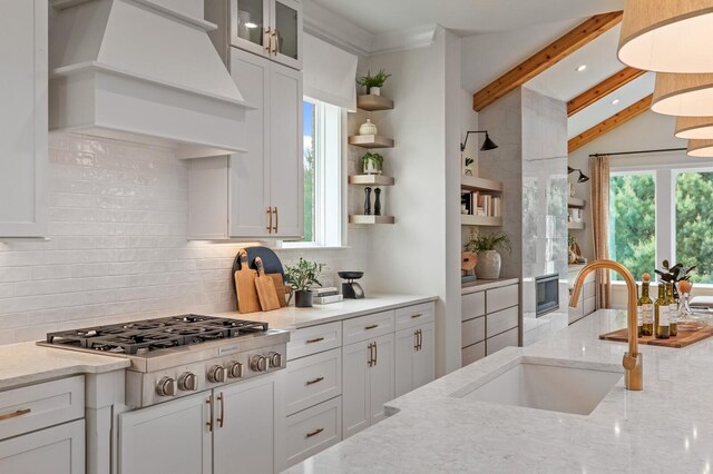 7271 Murrel Dr, Franklin, TN 37064 - kitchen featuring a sink, stainless steel gas stovetop, open shelves, tasteful backsplash, and beam ceiling