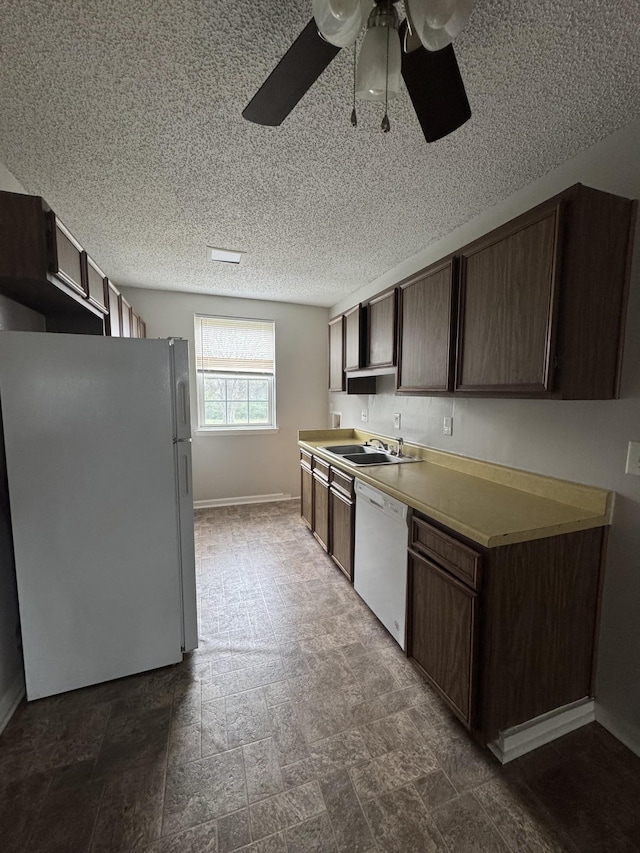 1301 Neelys Bend Rd Unit 43, Madison, TN 37115 - kitchen with white appliances, dark brown cabinets, ceiling fan, baseboards, and a textured ceiling