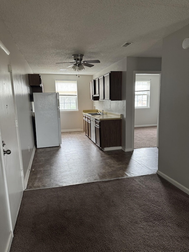 1301 Neelys Bend Rd Unit 43, Madison, TN 37115 - kitchen with freestanding refrigerator, a sink, light countertops, ceiling fan, and baseboards
