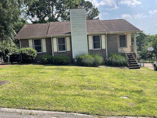 3309 Cedar Ridge Rd, Nashville, TN 37214 - view of front of property with brick siding, a chimney, a front yard, stairs, and a shingled roof
