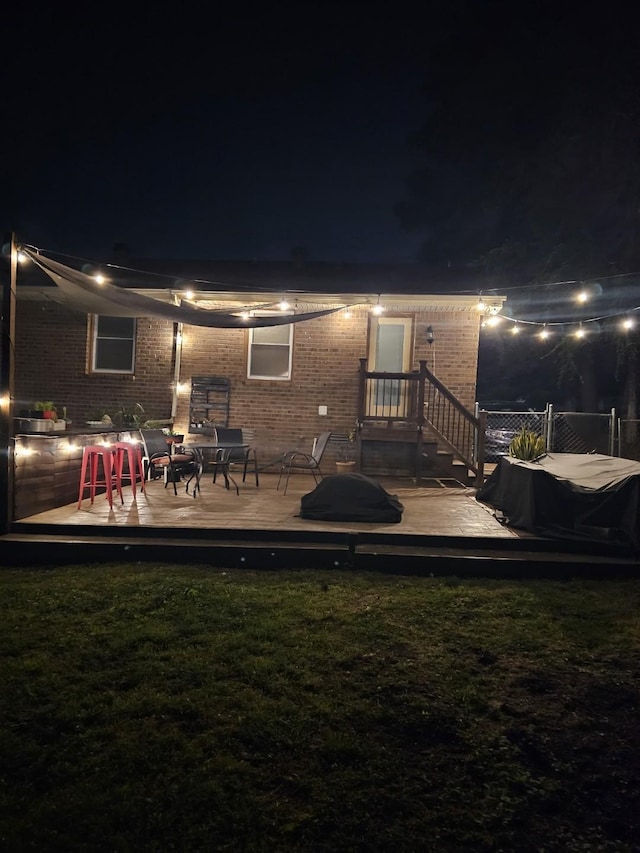3309 Cedar Ridge Rd, Nashville, TN 37214 - back of house at twilight featuring brick siding and a wooden deck