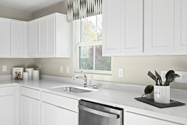 100 Walden Way, Gallatin, TN 37066 - kitchen with stainless steel dishwasher, a sink, light countertops, and white cabinetry