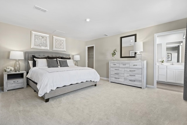 100 Walden Way, Gallatin, TN 37066 - bedroom featuring light carpet, baseboards, and connected bathroom