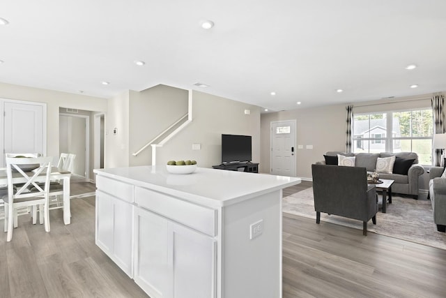 100 Walden Way, Gallatin, TN 37066 - kitchen featuring light wood-style flooring, open floor plan, a kitchen island, white cabinets, and light countertops