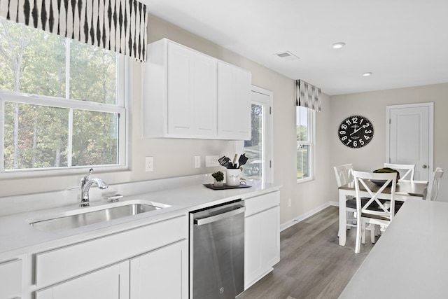100 Walden Way, Gallatin, TN 37066 - kitchen with stainless steel dishwasher, a sink, light countertops, white cabinetry, and recessed lighting
