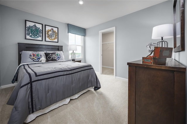1680 Laurel St, Gallatin, TN 37066 - bedroom featuring light colored carpet, baseboards, and a walk in closet