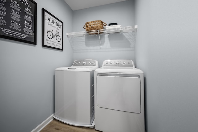 1680 Laurel St, Gallatin, TN 37066 - laundry room with independent washer and dryer, wood finished floors, and baseboards