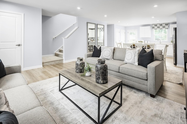 1680 Laurel St, Gallatin, TN 37066 - living area featuring stairs, light wood-style floors, recessed lighting, and baseboards