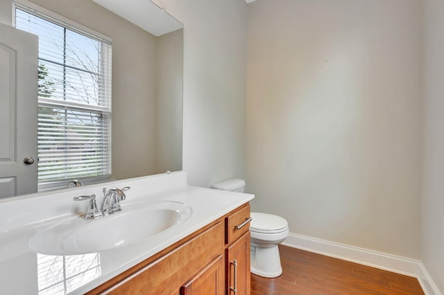 356 Irvine Ln, Franklin, TN 37064 - half bathroom with toilet, vanity, baseboards, and wood finished floors