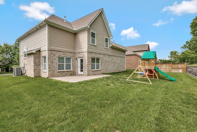 356 Irvine Ln, Franklin, TN 37064 - rear view of property with central AC unit, a playground, a patio area, and brick siding